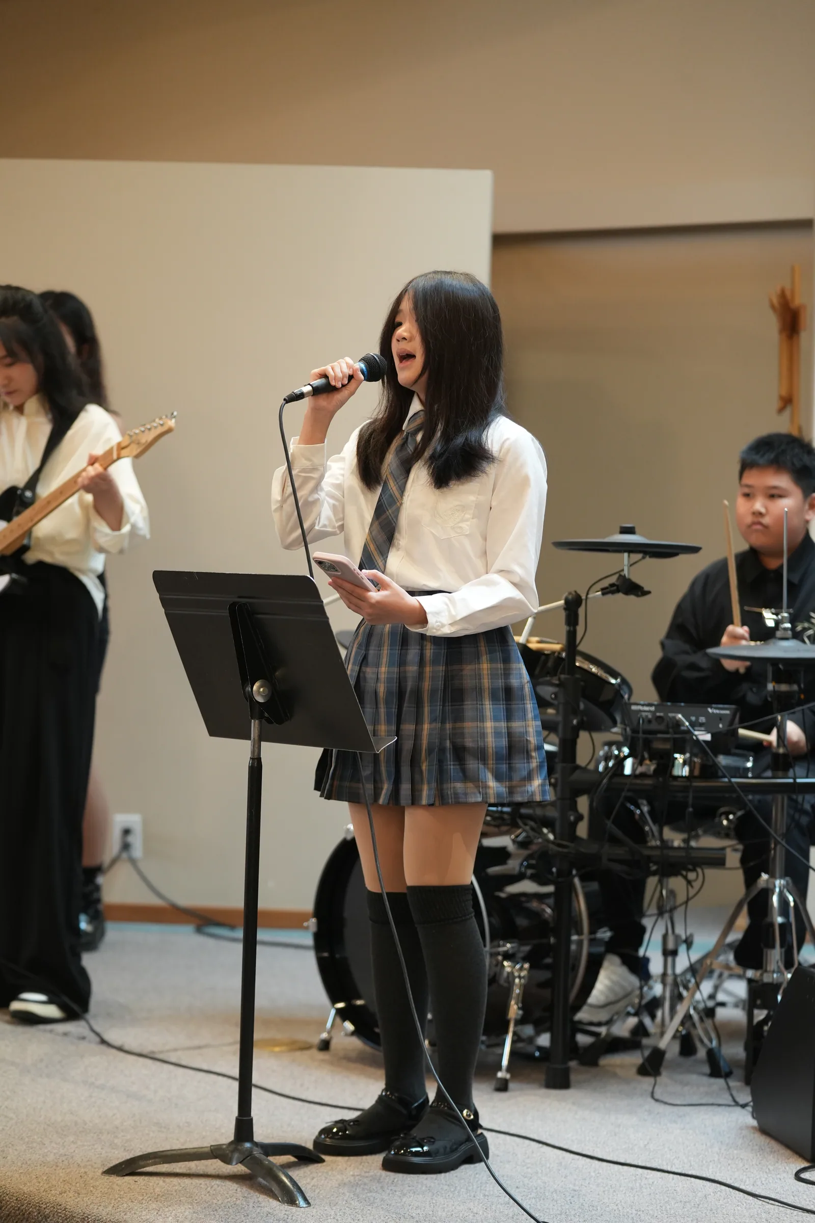 Student performance moment from Reindeer Education's 2025 public gallery.