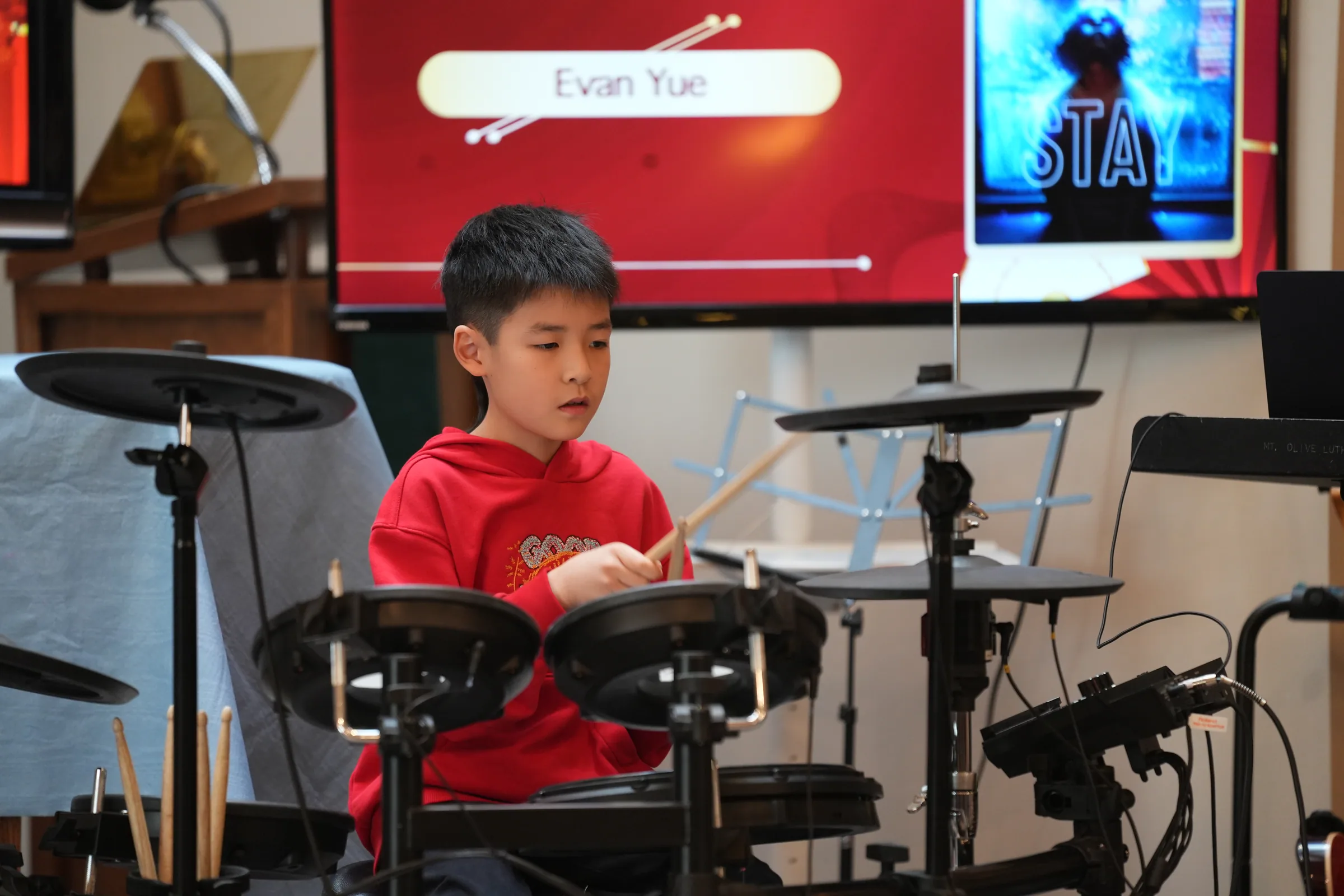 Student performance moment from Reindeer Education's 2025 public gallery.