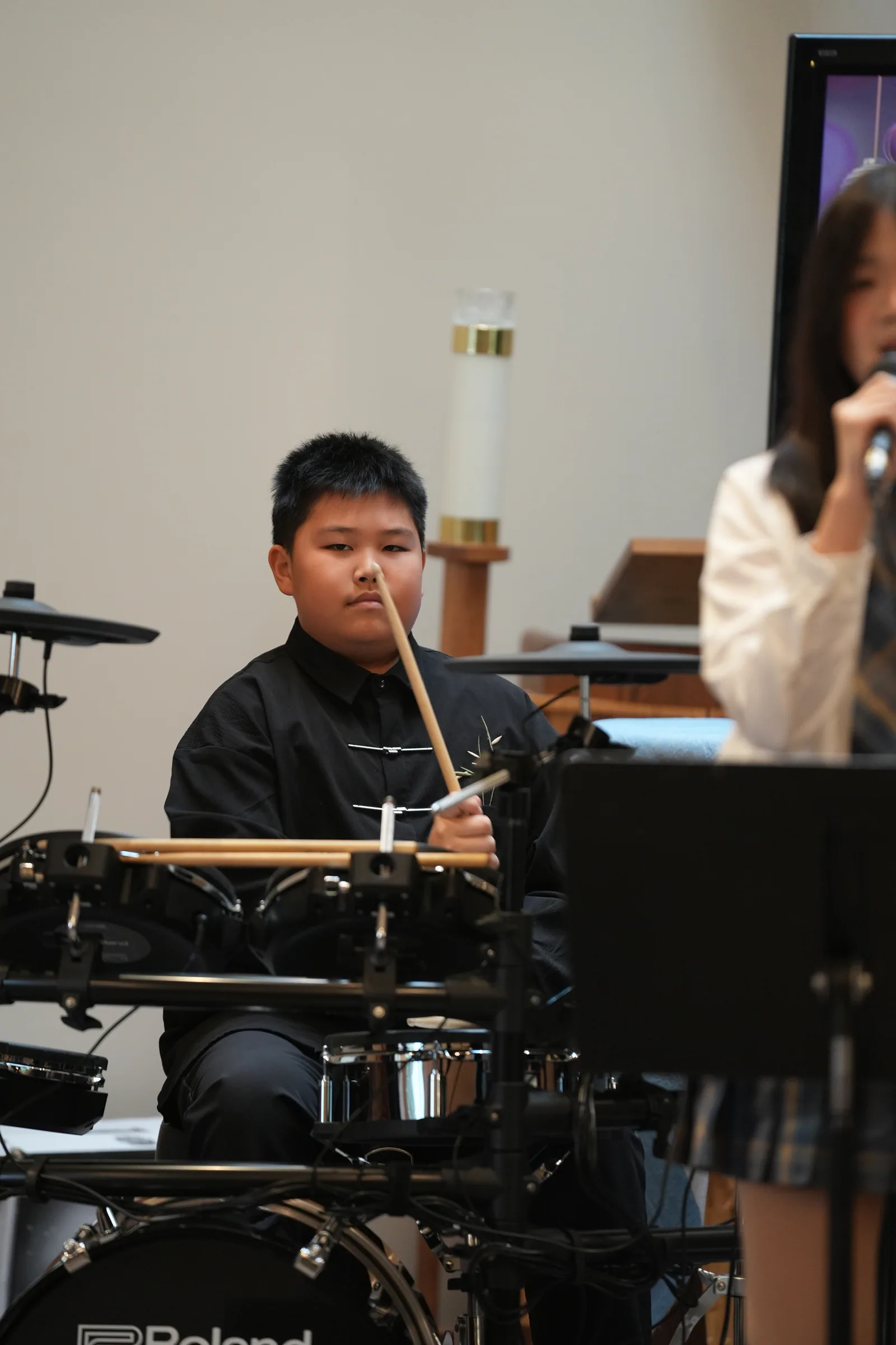 Student performance moment from Reindeer Education's 2025 public gallery.