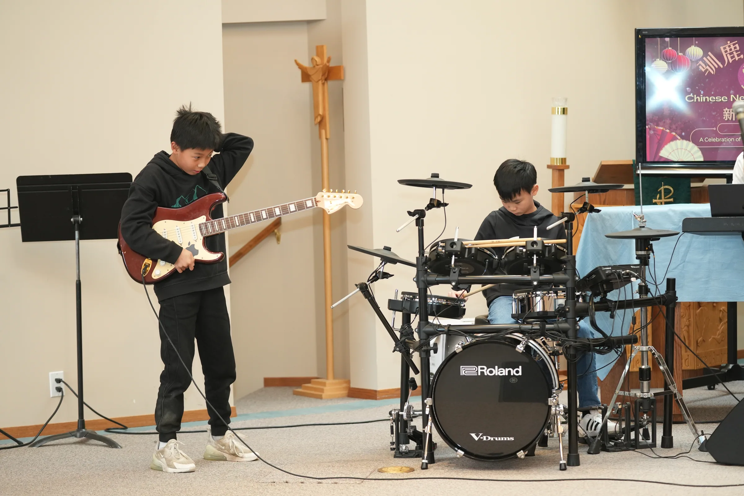 Student ensemble performance at Reindeer Education's 2025 public gallery.