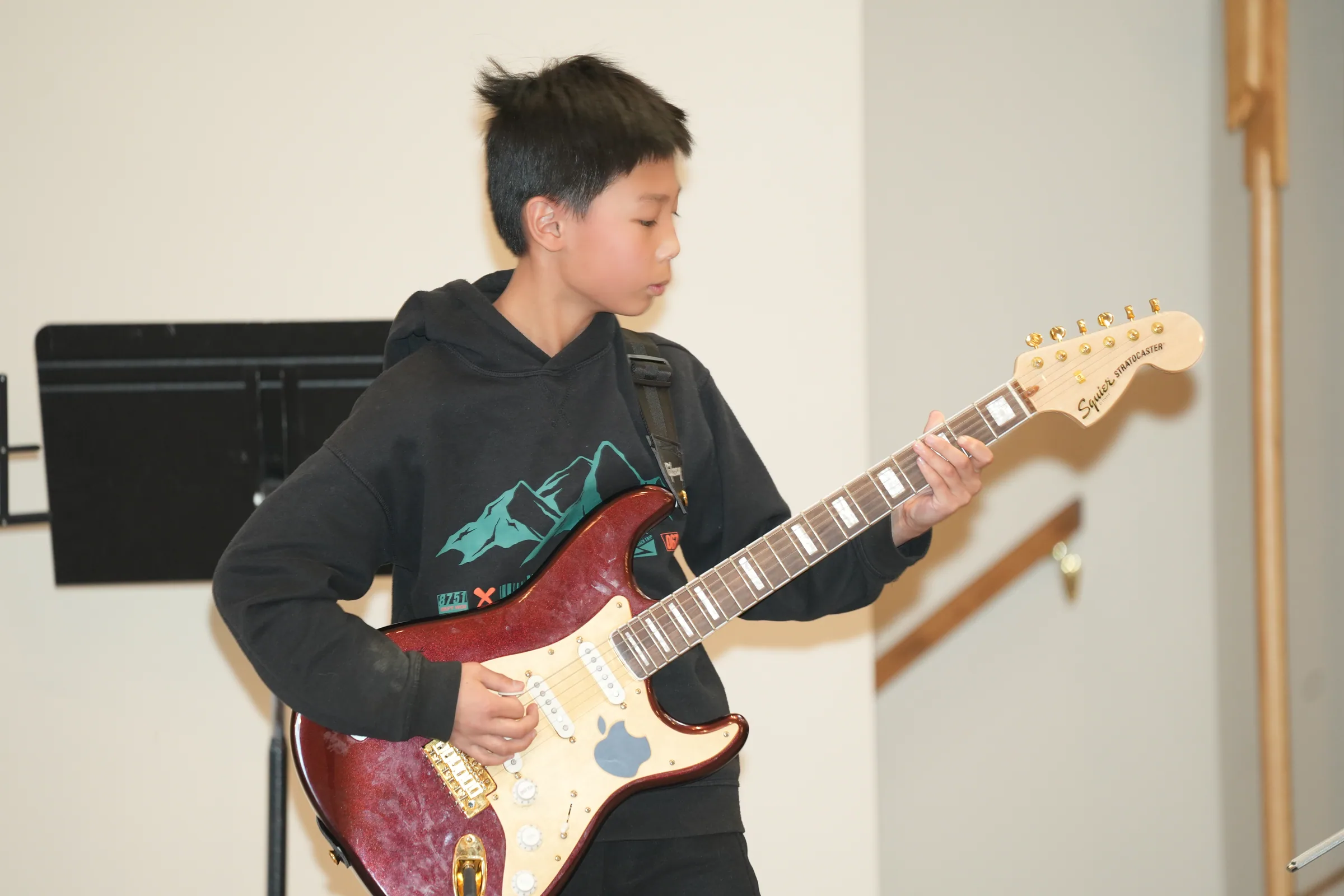 Student ensemble performance at Reindeer Education's 2025 public gallery.