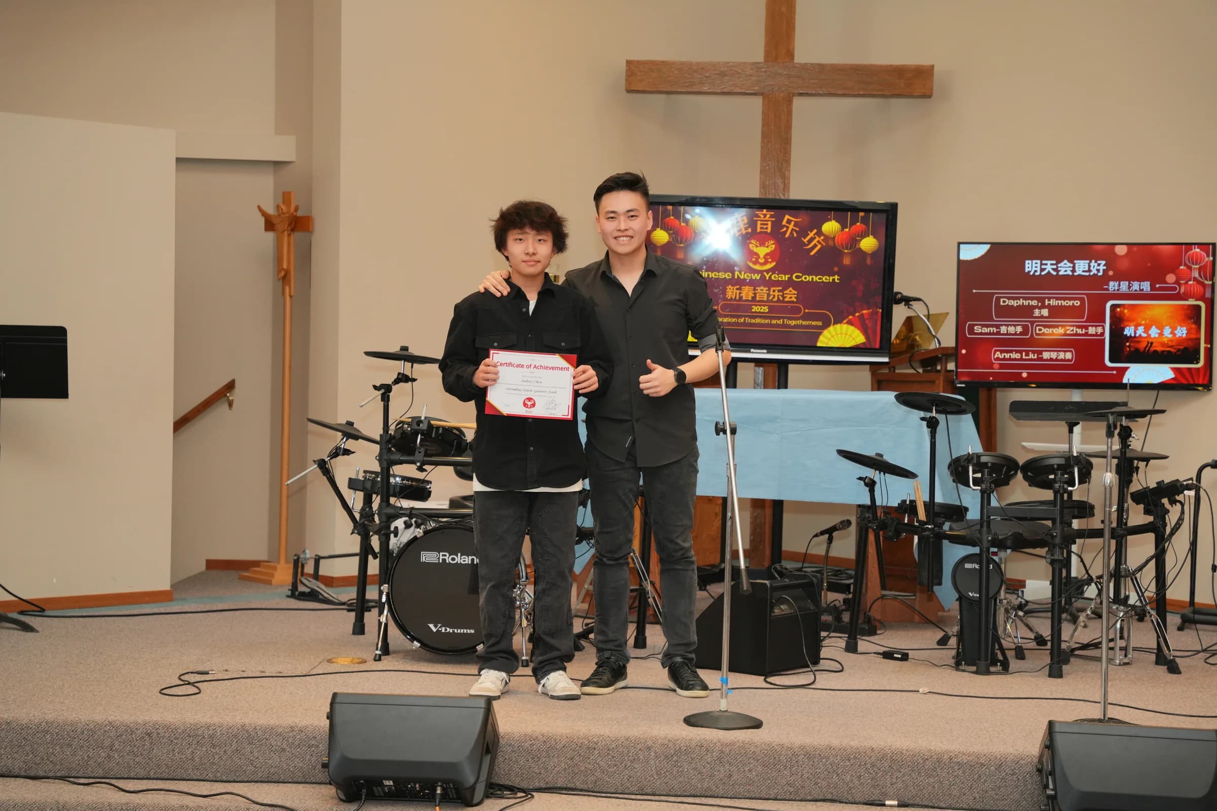 Andrew Chen receiving the Outstanding Acoustic Guitarist Award.