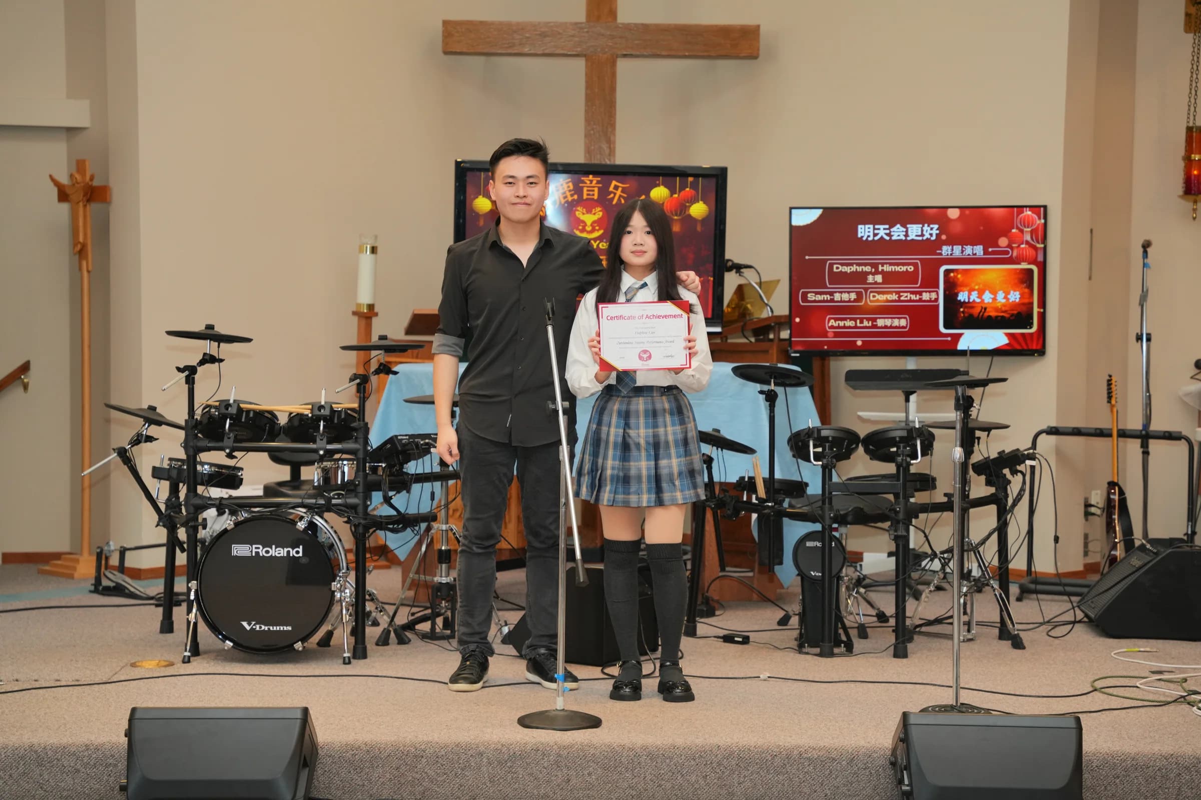 Daphne Cao receiving the Outstanding Singing Performance Award.