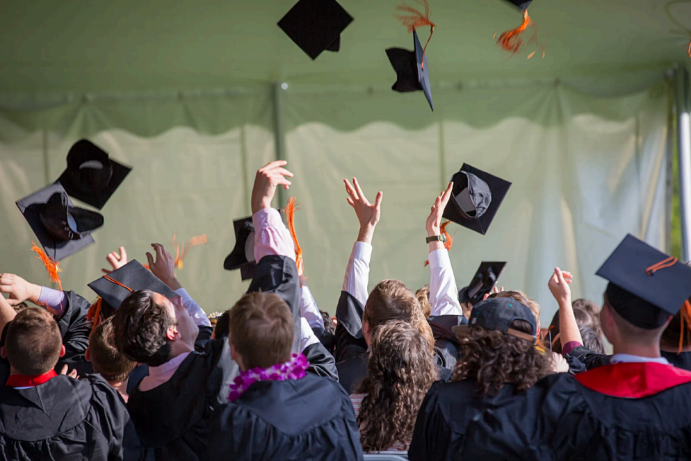 Graduates tossing caps at Edmonds College